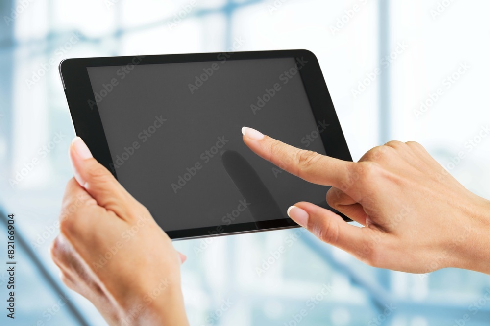 Tablet. Hands holding a tablet with isolated screen