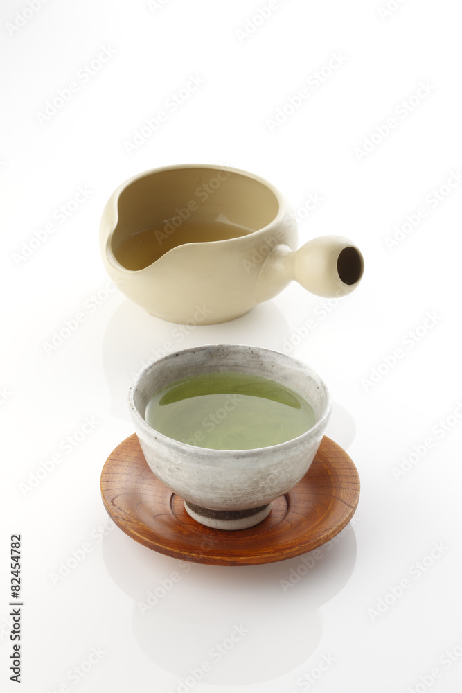 Japanese green tea in porcelain cup and tea pot.