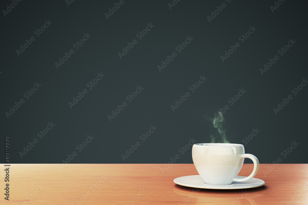 cup of coffee on a wooden table with copyspace
