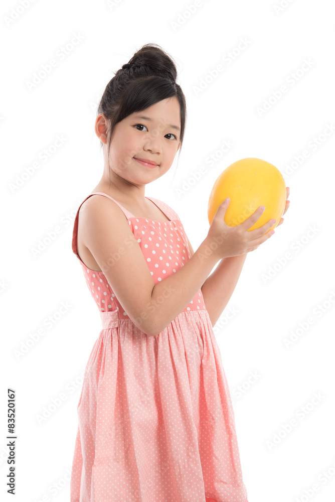 Little asian girl holding melon