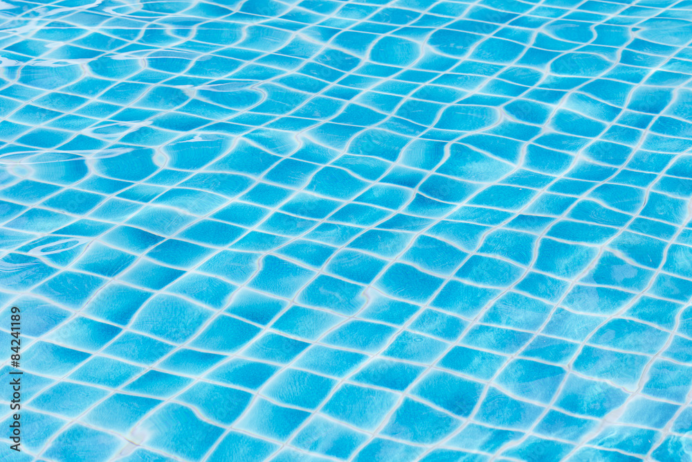 Blue sky swimming pool water texture reflection.