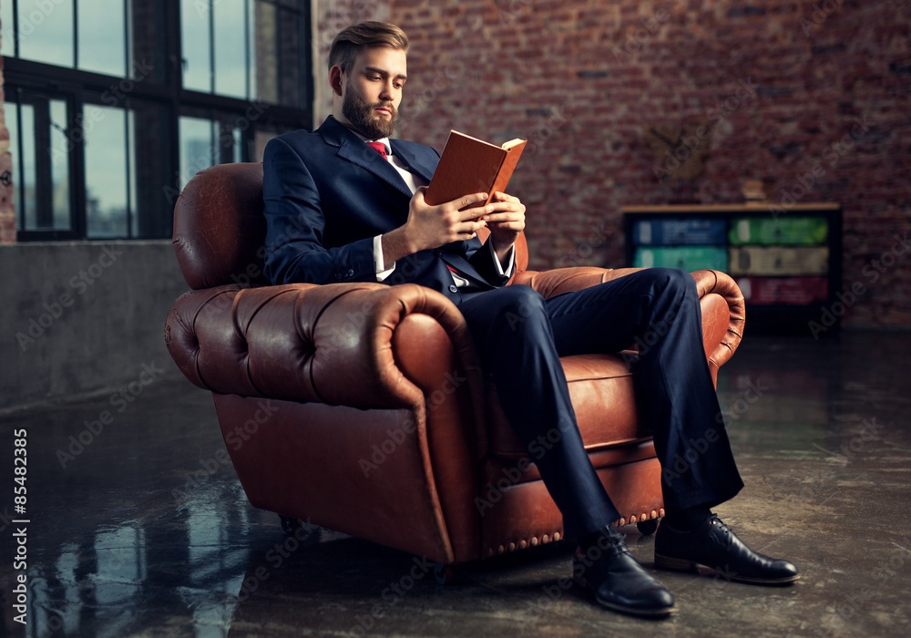 Businessman reading book