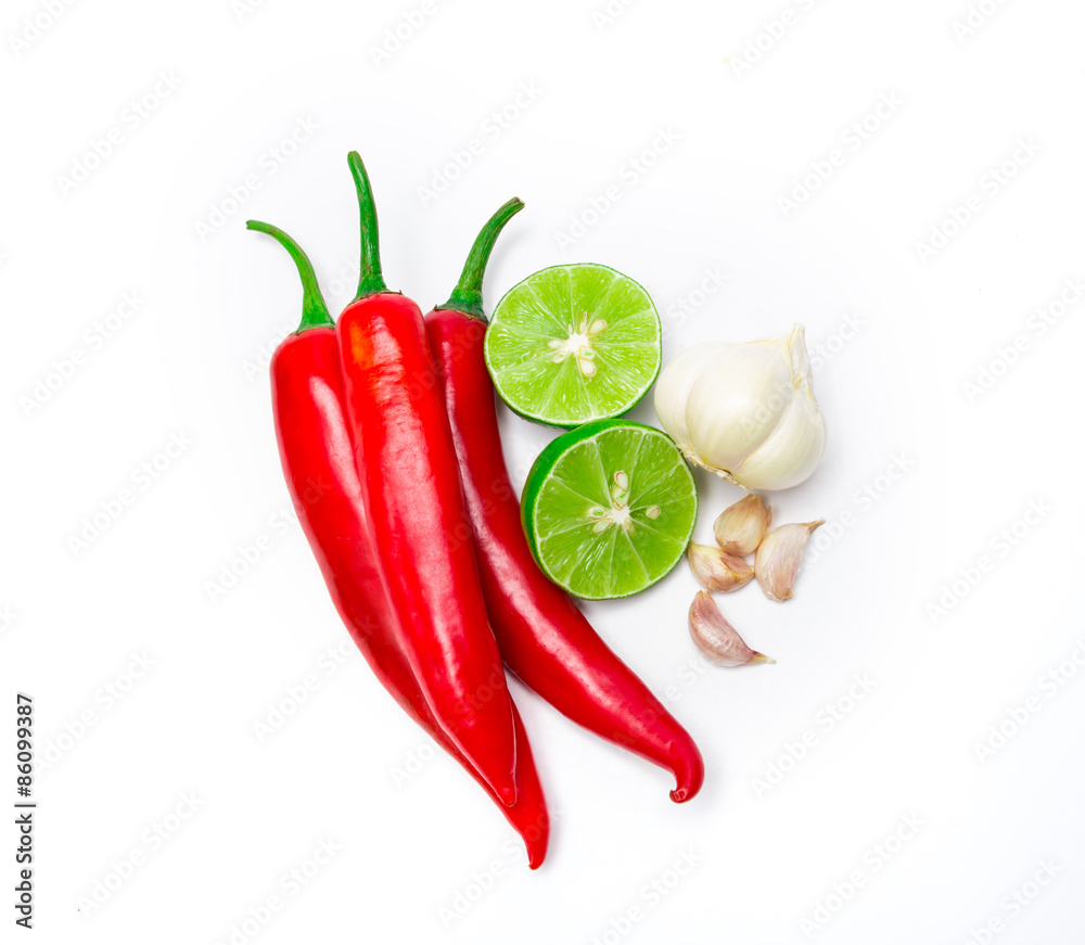 red chili , garlic and lime lemon arrange on white background