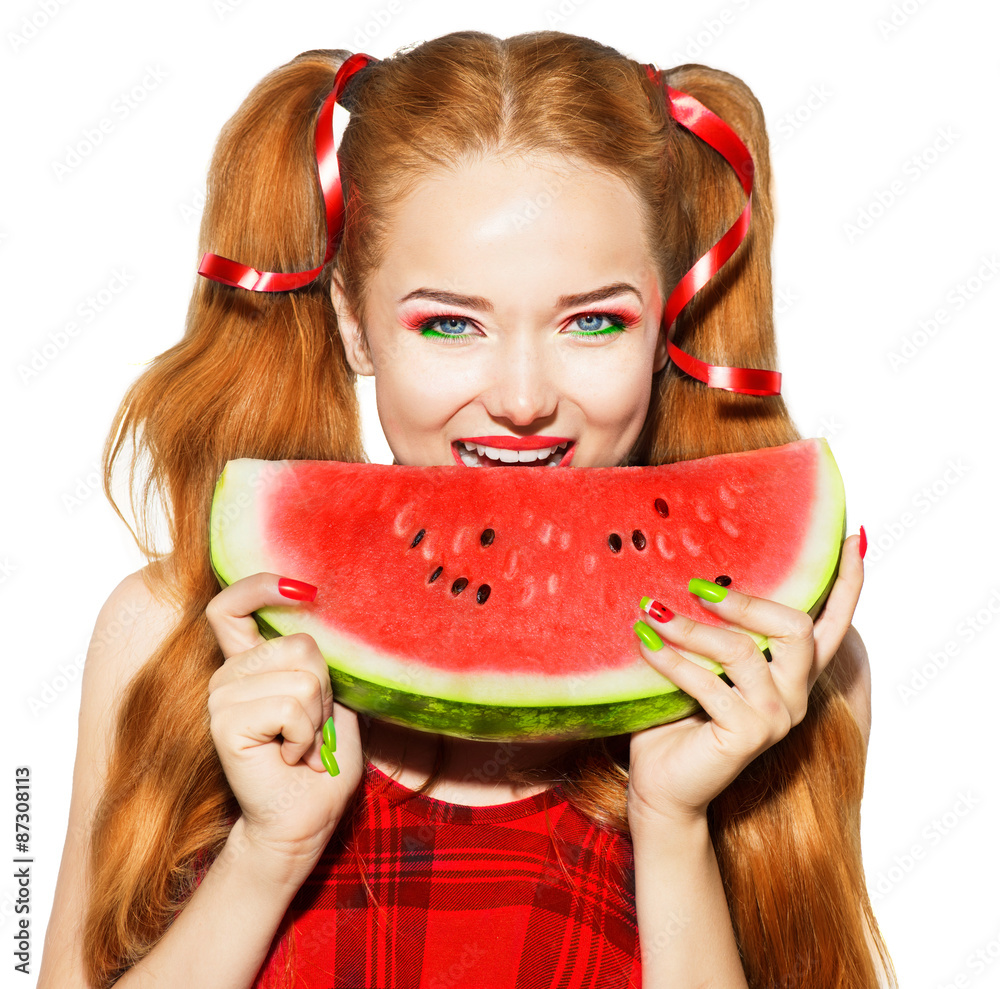 Beauty teenage model girl eating watermelon