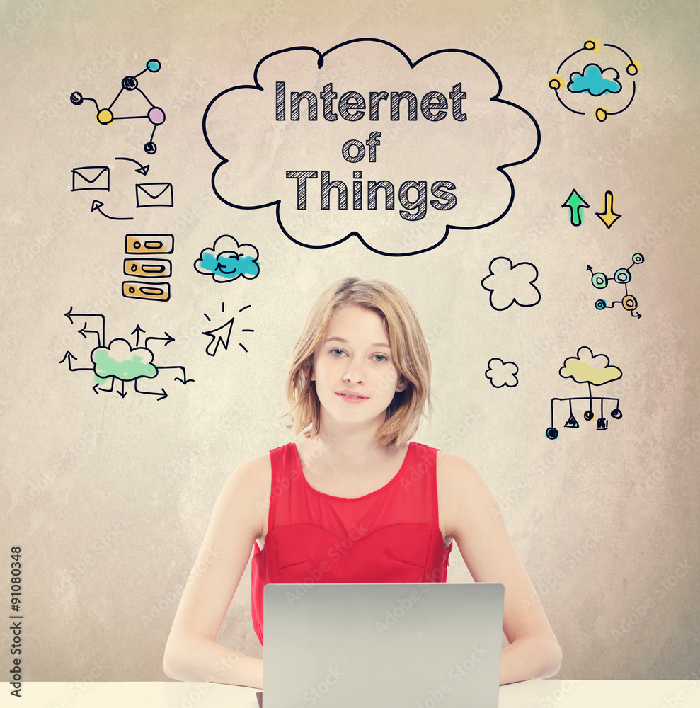 Internet of Things concept with young woman with laptop