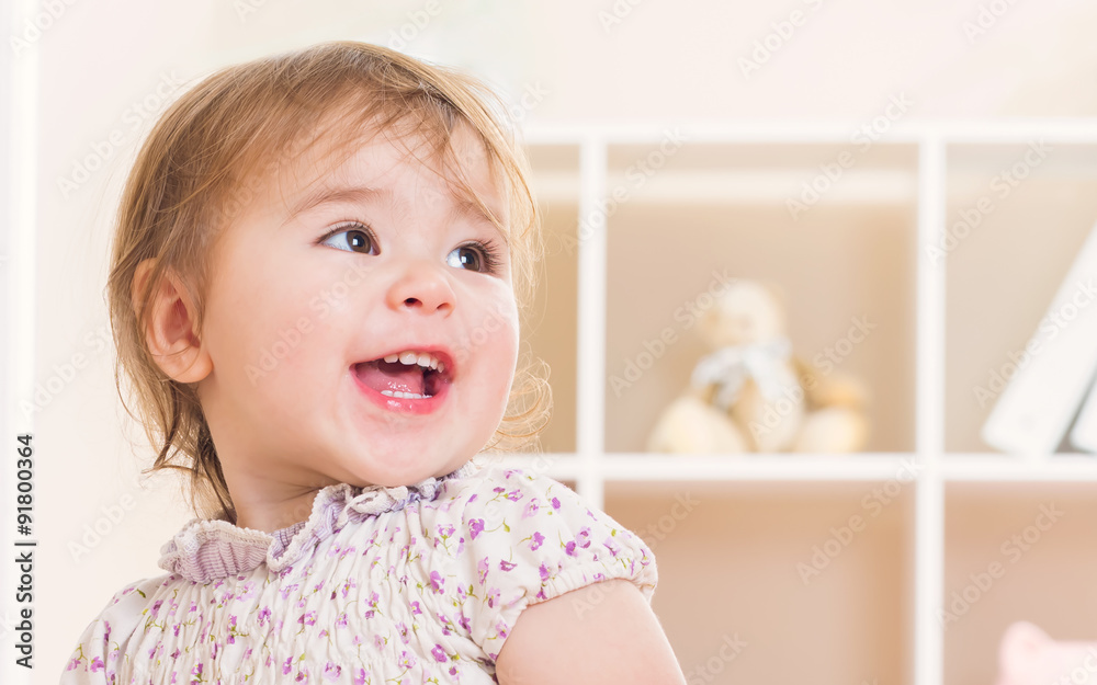 Happy toddler girl with a great big smile