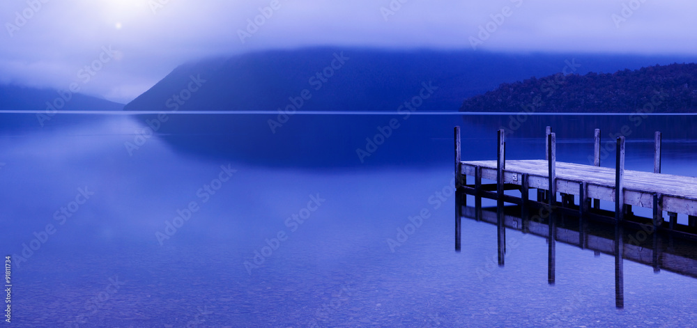 Tranquil peaceful lake with jetty New Zealand Concept