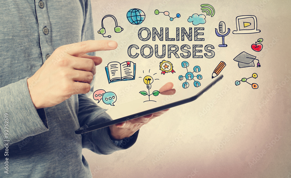 Young man pointing at Online Courses concept