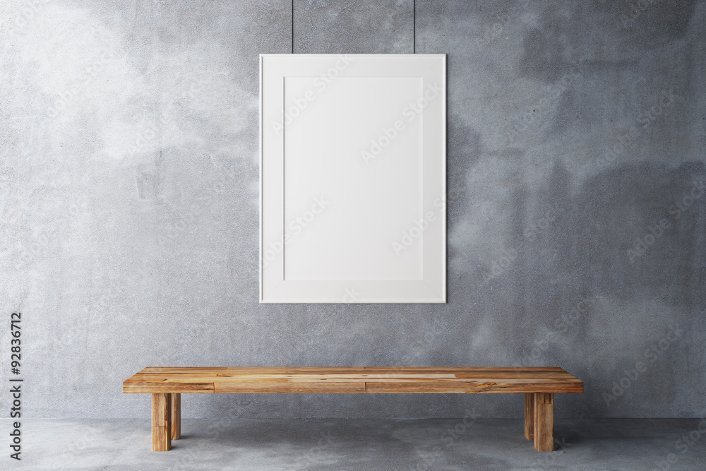 Blank frame in the gallery on a concrete wall
