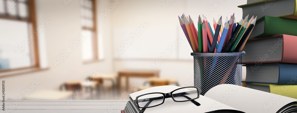 Composite image of school supplies on desk