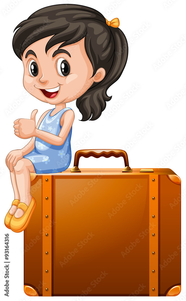 Little girl sitting on a suitcase