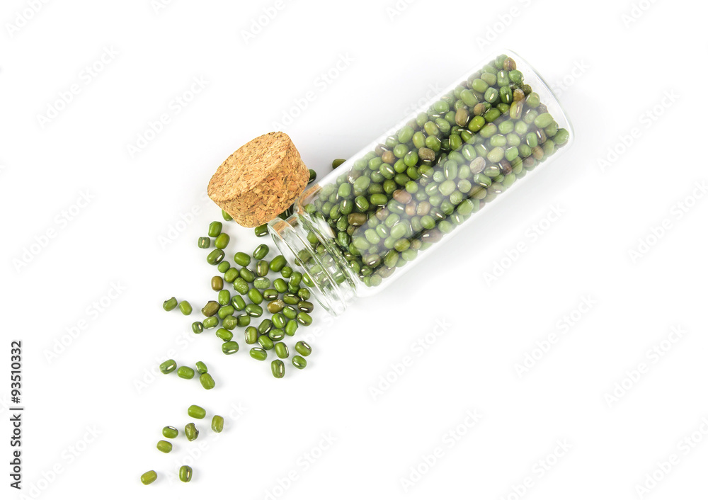 close up green mung beans in glass bottle on white background