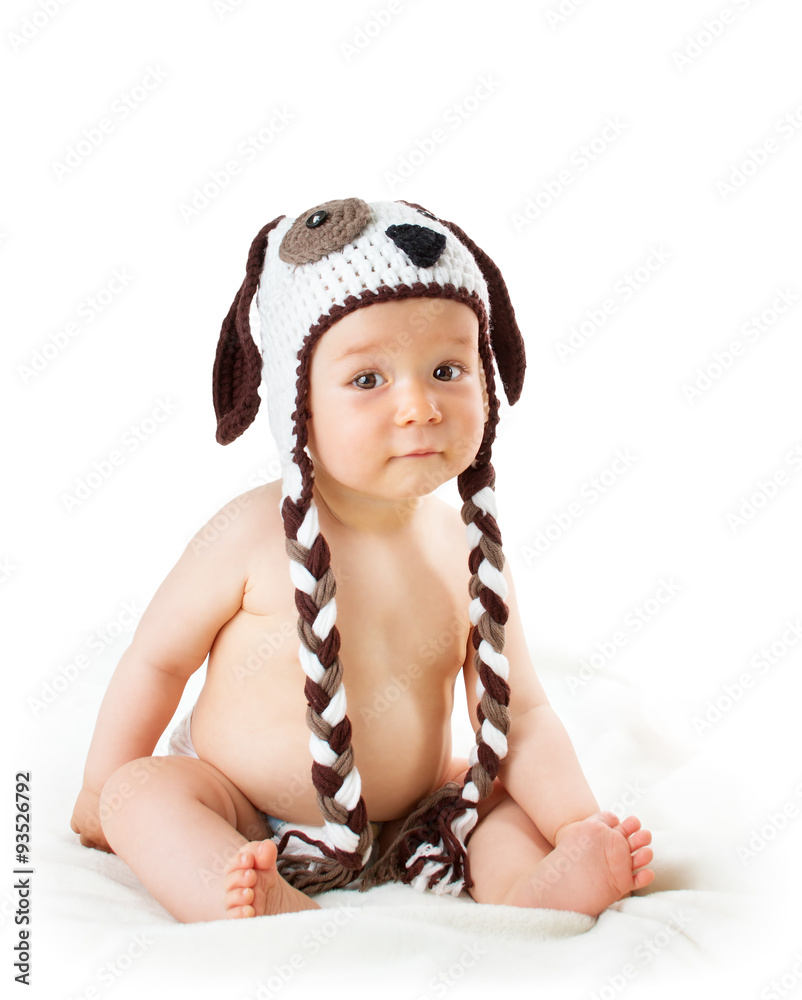 Baby in dog hat isolated on white background