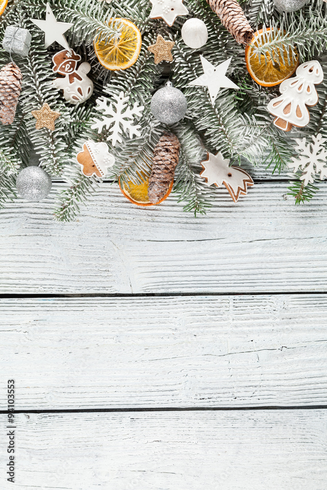 Christmas fir tree with decoration on a wooden board