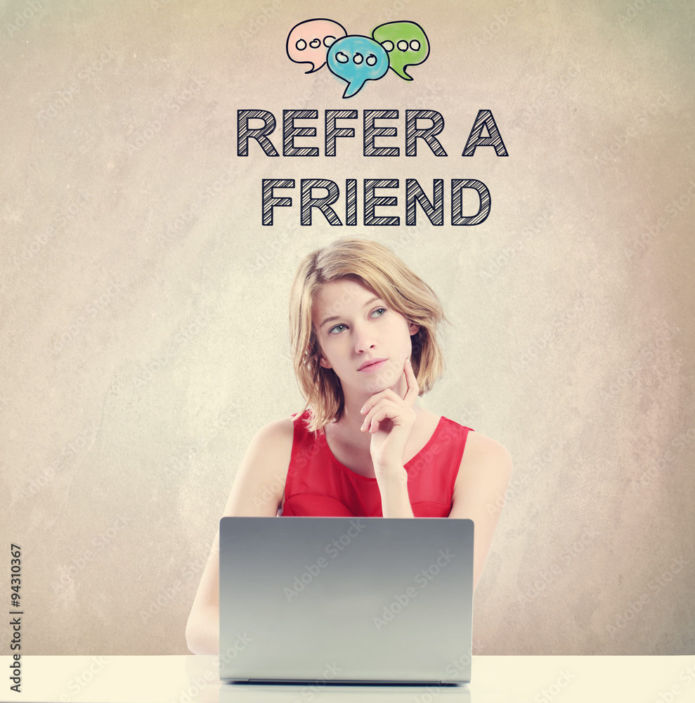 Refer A Friend concept with woman working on a laptop