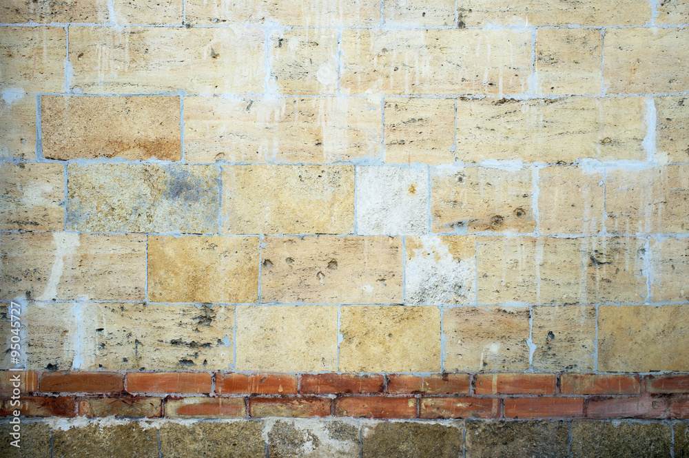 Vintage wall of sandstone bricks