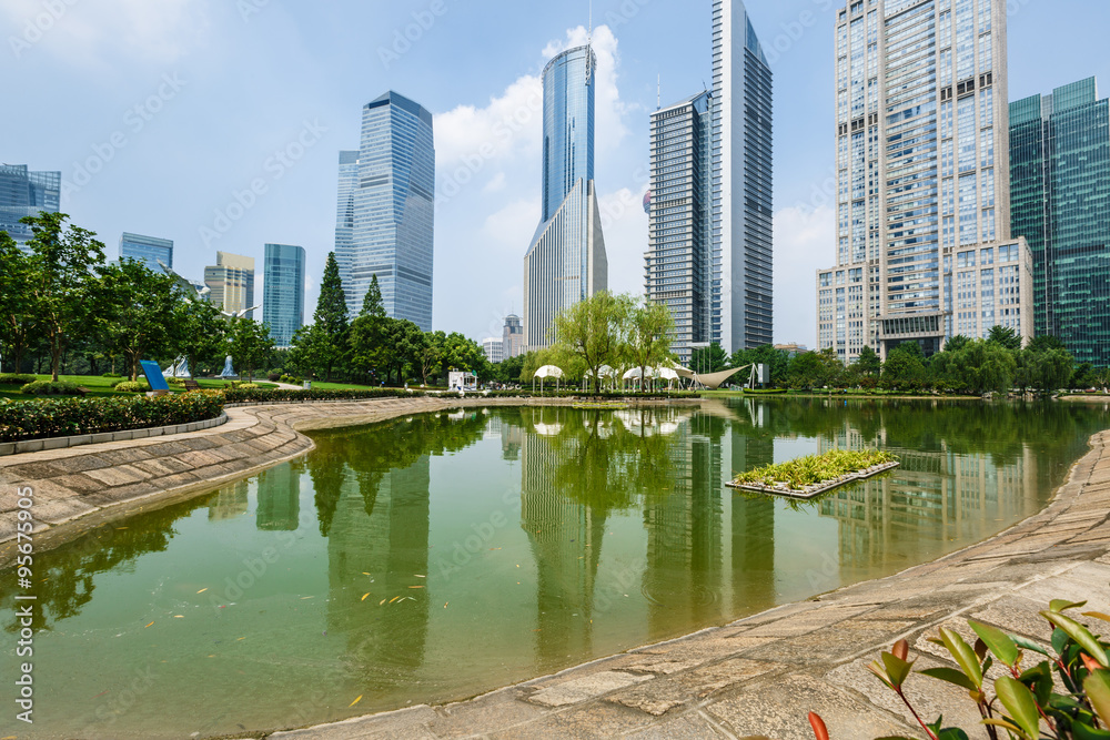 park and skyscrapers under the blue sky in shanghai，china