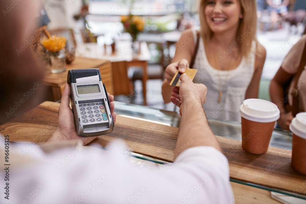 Customer paying at a cafe with credit card
