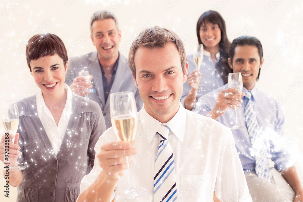 Composite image of business people toasting with champagne