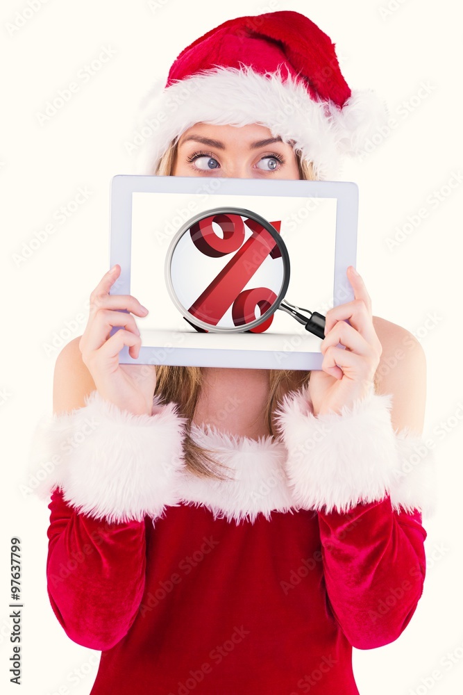 Composite image of pretty santa girl holding tablet
