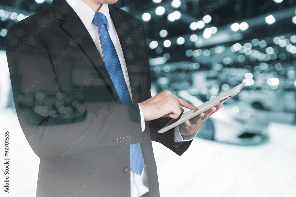 Double exposure of Businessman using digital tablet to handle sa