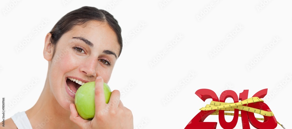 Brunette eating a green apple