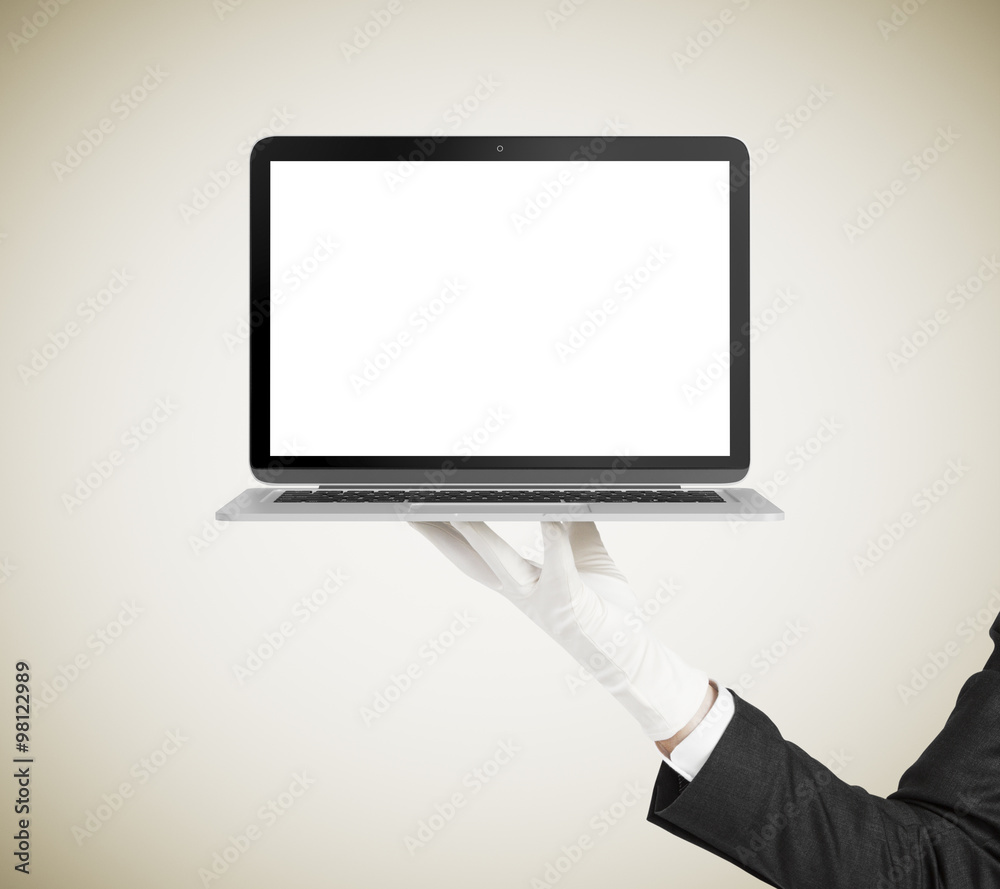 Man hand in white glove holding laptop with blank screen, mock u