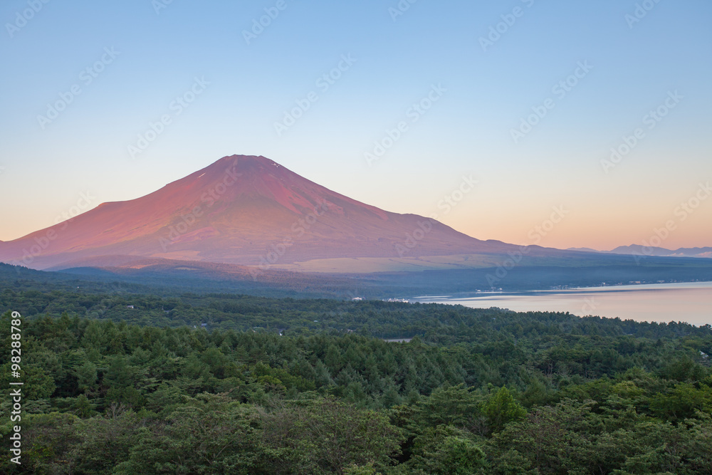 Red color at Top of Mountain Fuji in summer early morning seen from Lake Yamanaka , Yamanashi prefec