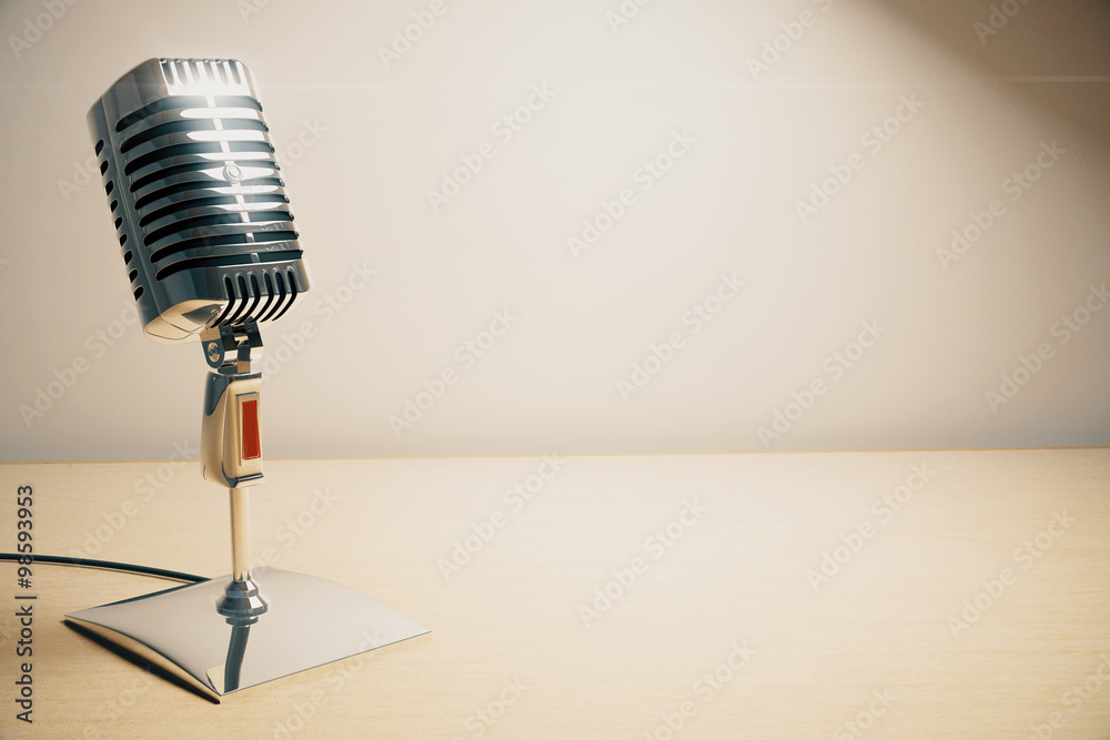 Vintage microphone on white wooden table