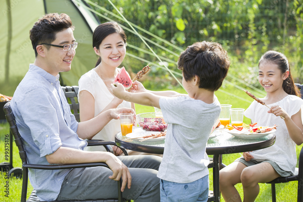 Young family picnicking outdoors