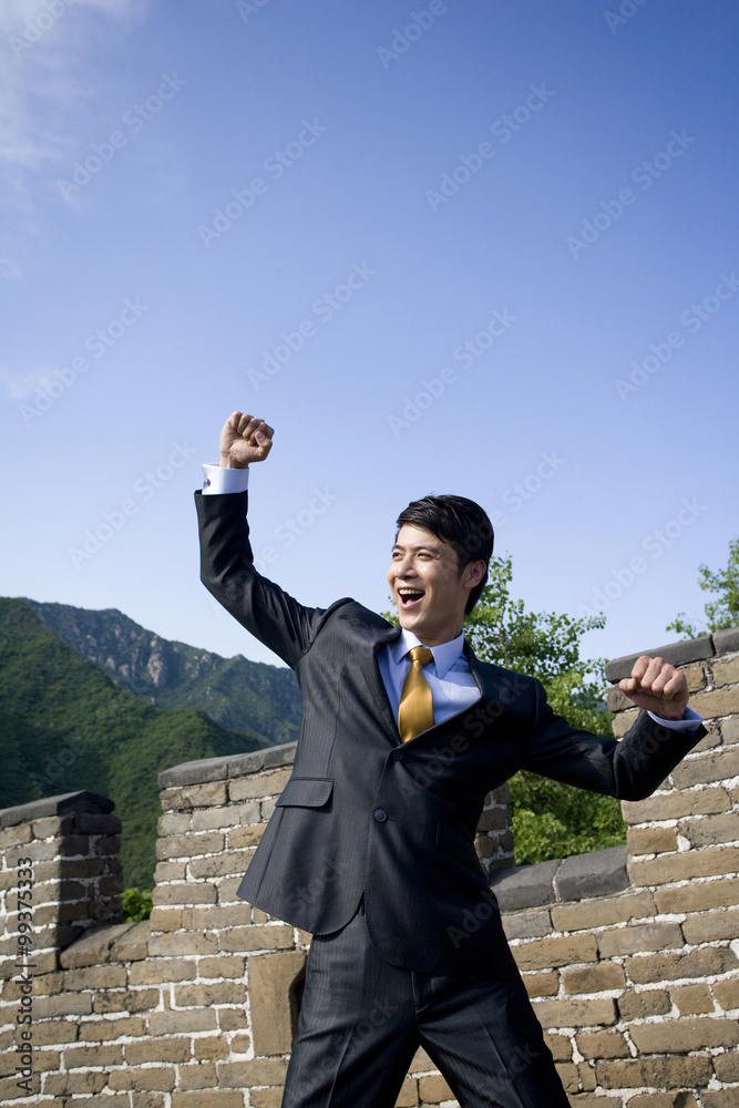 Happy businessman on the Great Wall