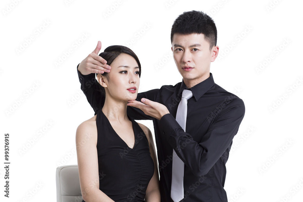 Male makeup artist and young woman