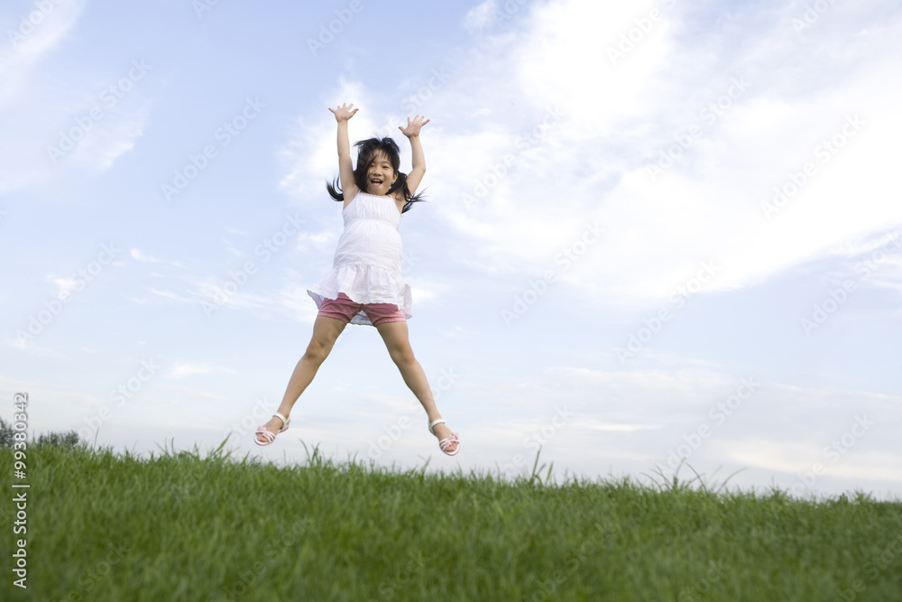 Girl jumping in mid-air