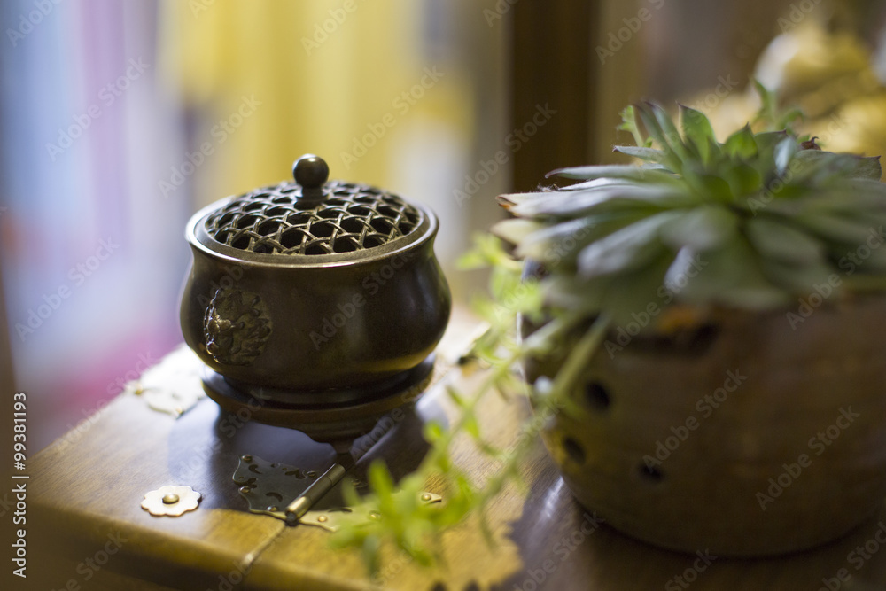 Traditional Chinese censer and potted plant