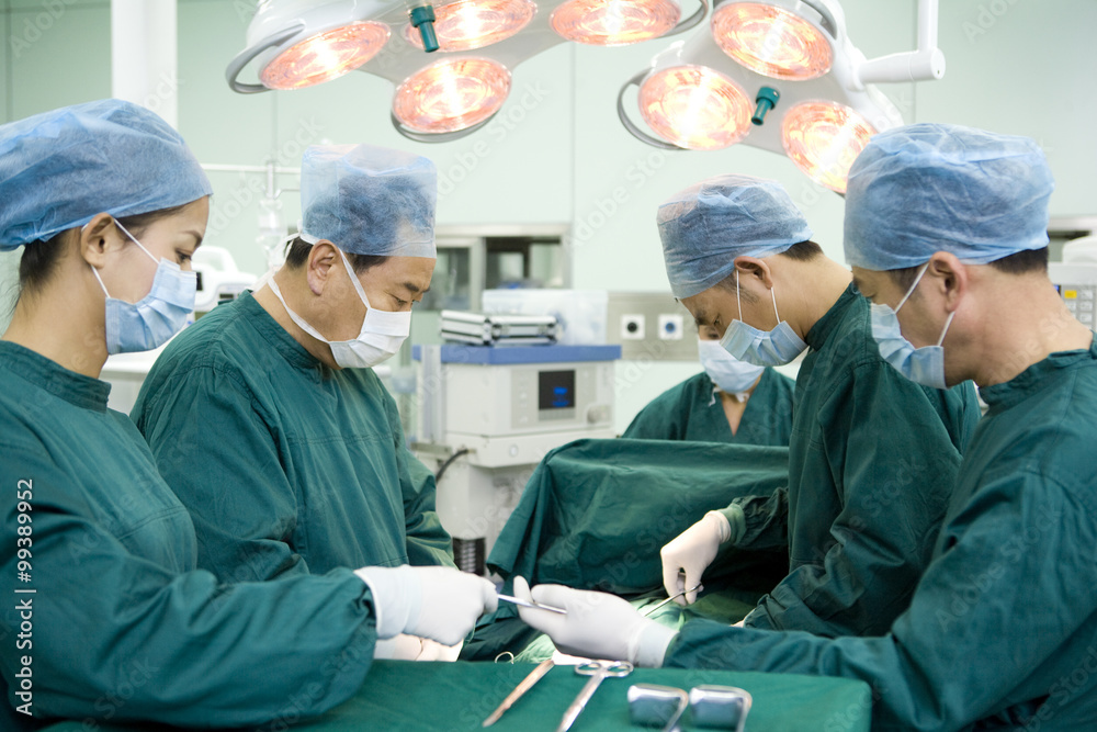 Team of surgeons working in an operating room