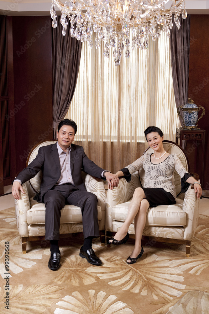 Senior couple sitting in a luxurious room