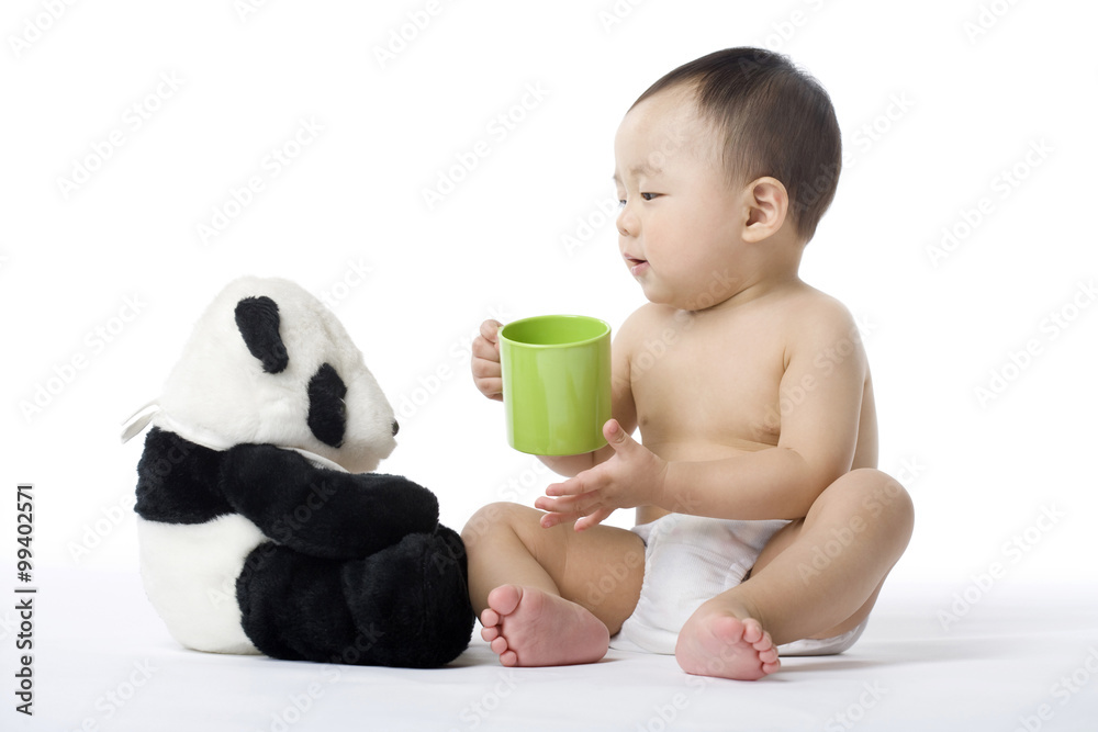 Infant with panda and cup