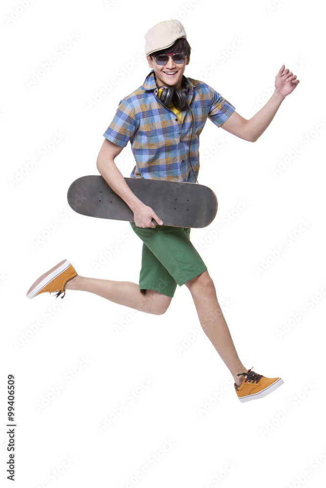 Cool young man with skateboard