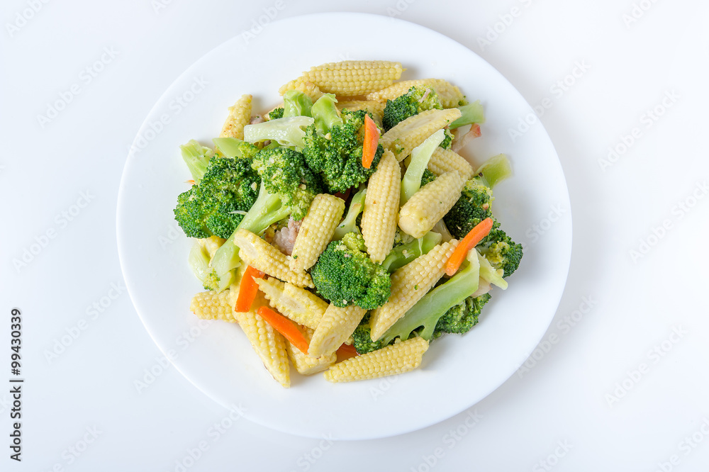 Green broccoli,baby corn,carrot on the plate