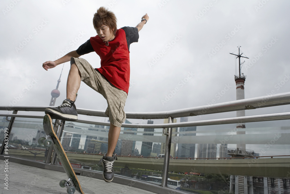 Teenager Posing With Skateboard In Shanghai