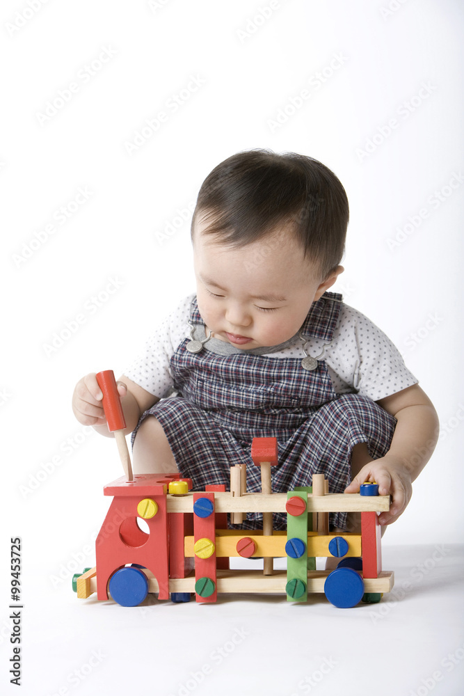 Infant with toy
