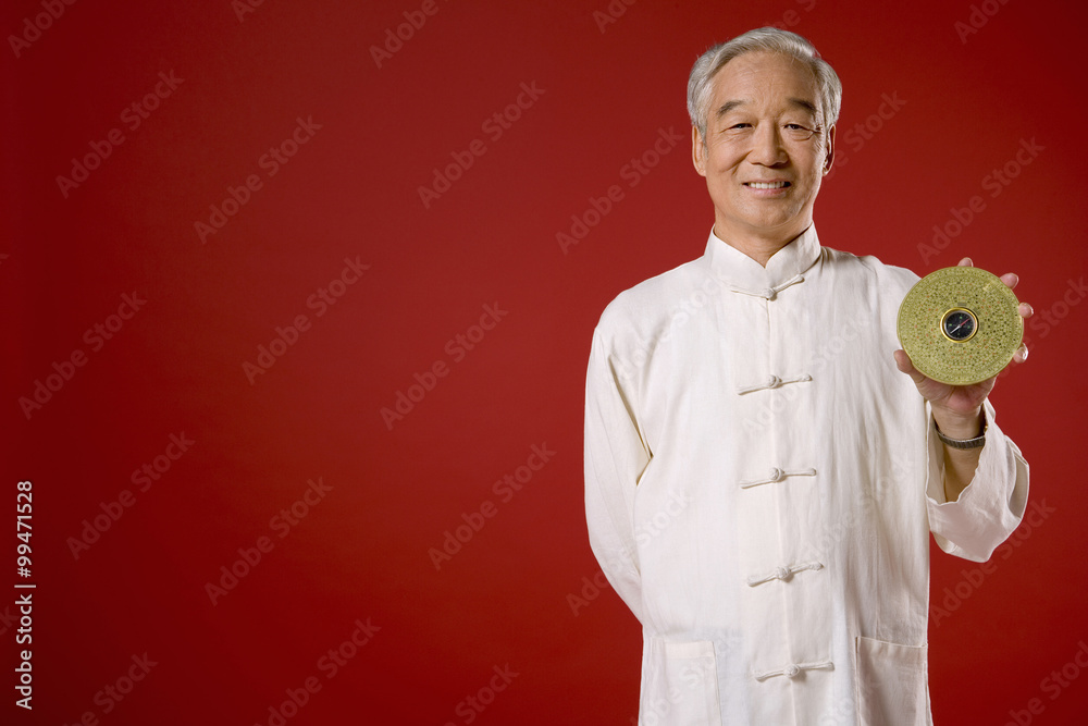 Elderly Man Holding Giant Chinese Coin