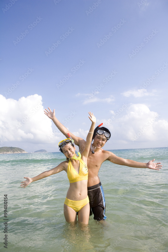 Young couple with snorkel gear