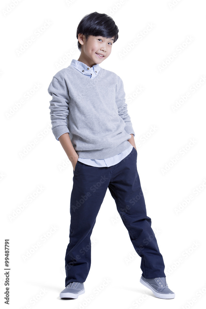 Portrait of trendy boy hands in pockets