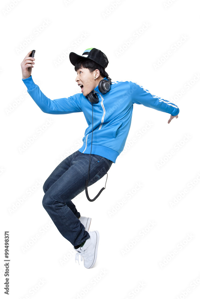 Man dancing while holding up his phone