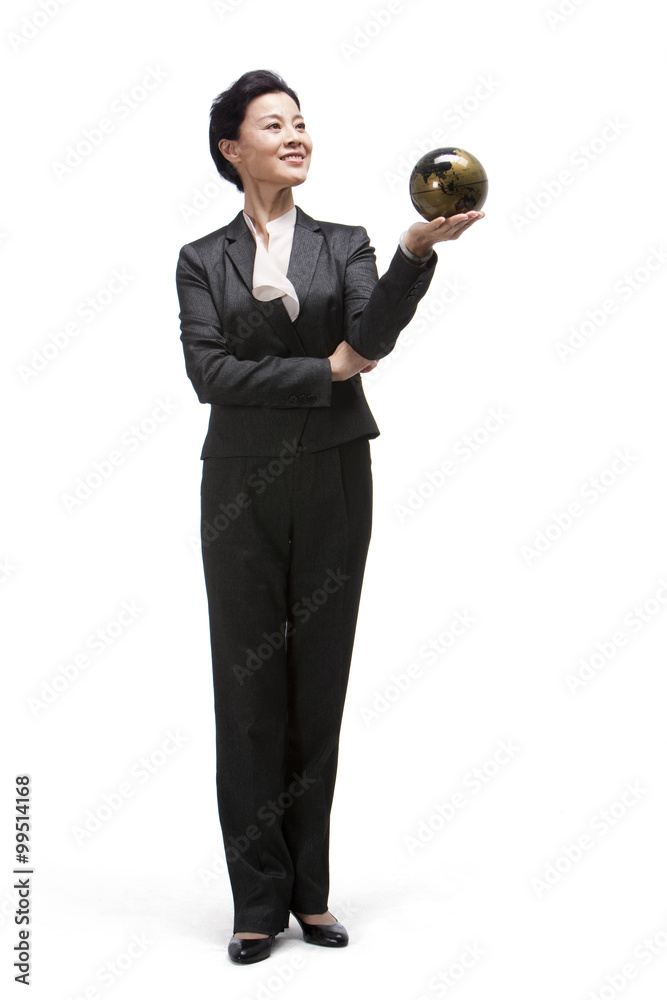 Middle-aged businesswoman holding a globe