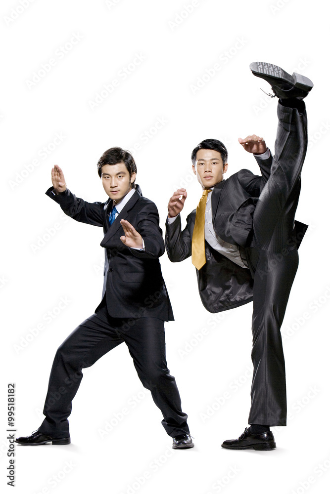Two businessmen fighting on white background