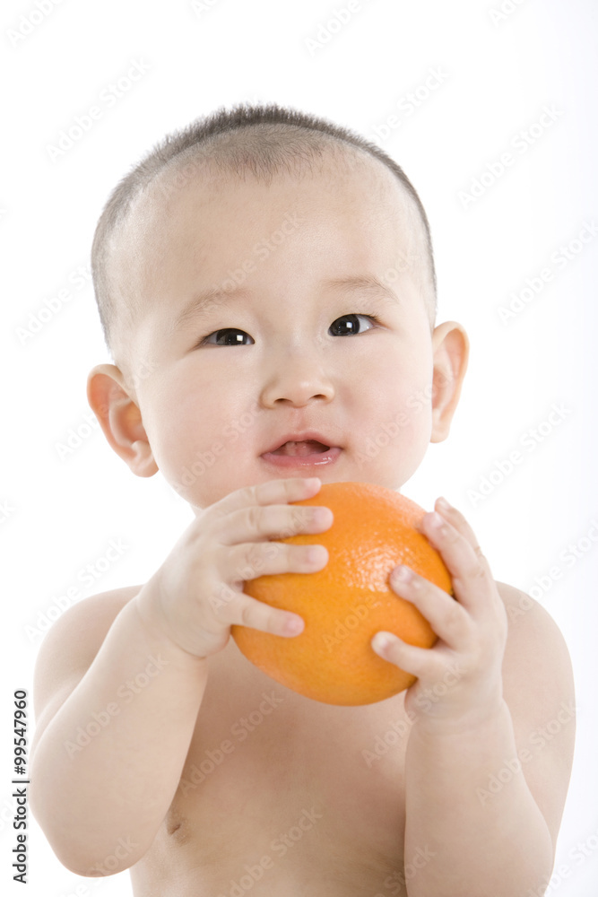 Infant with orange