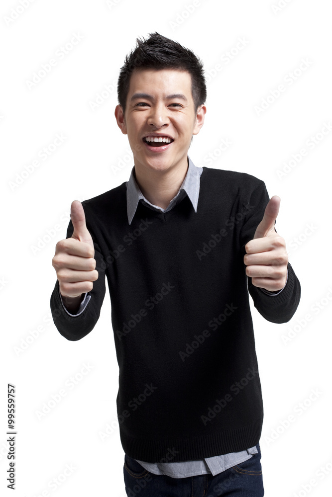 Stylish young man showing thumbs-up