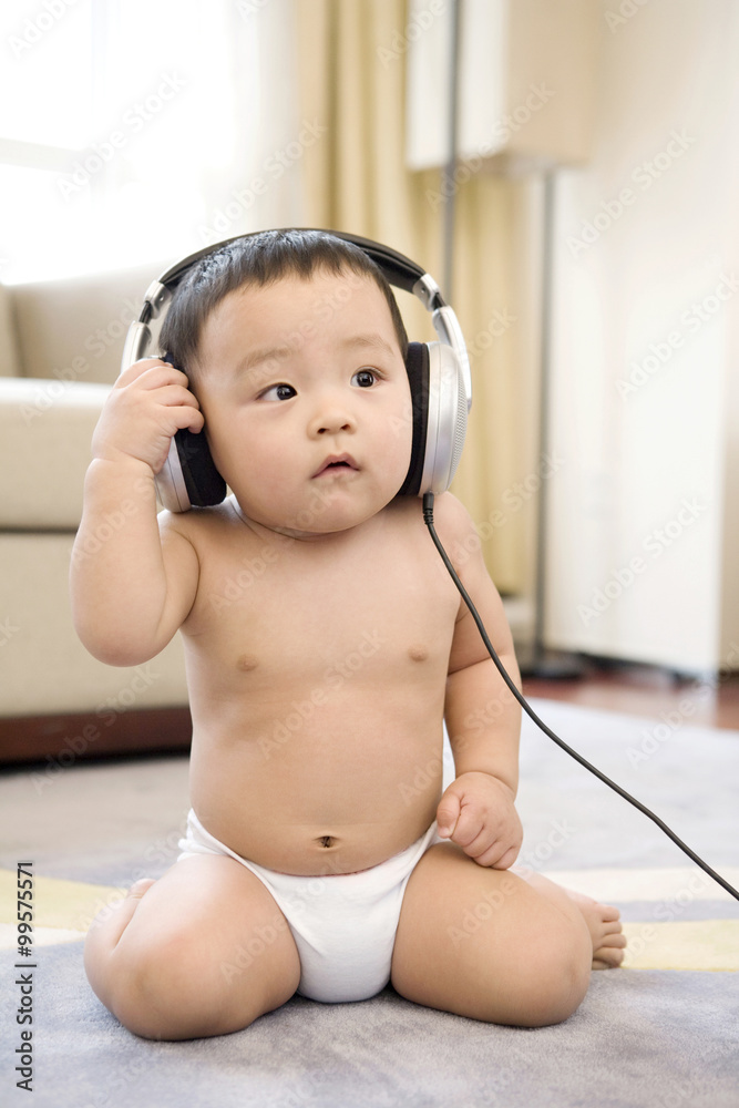 Infant with headphones